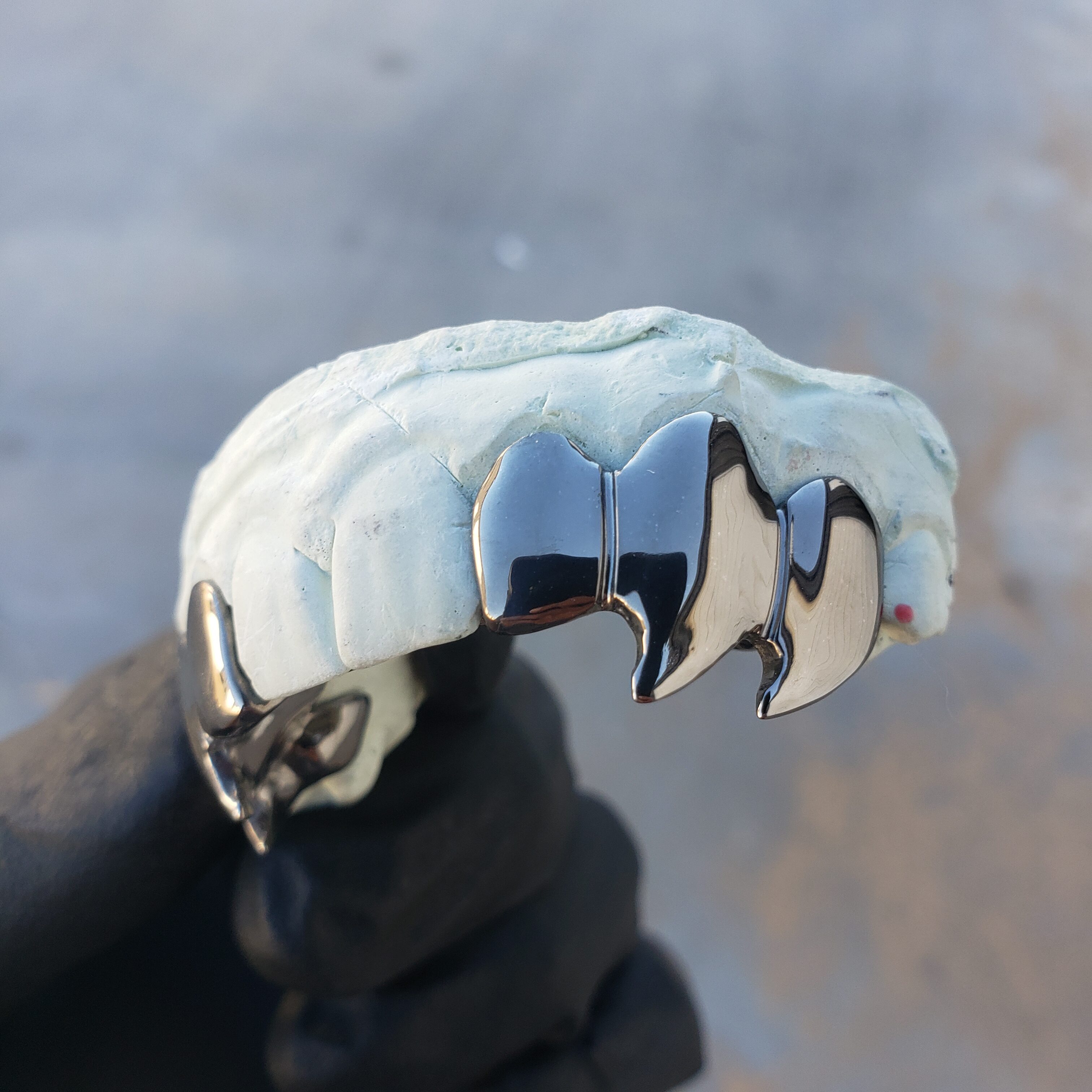 Black Gold Curved Wolf Fangs Top Grillz GotGrillz