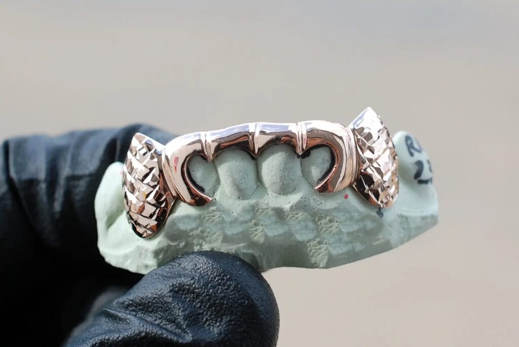Rose Gold Outline Style with Diamond Cut K9 Fangs Grillz