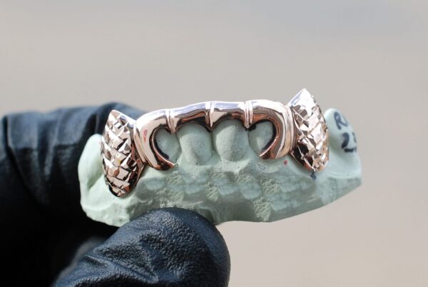 Rose Gold Outline Style with Diamond Cut K9 Fangs Grillz - GotGrillz
