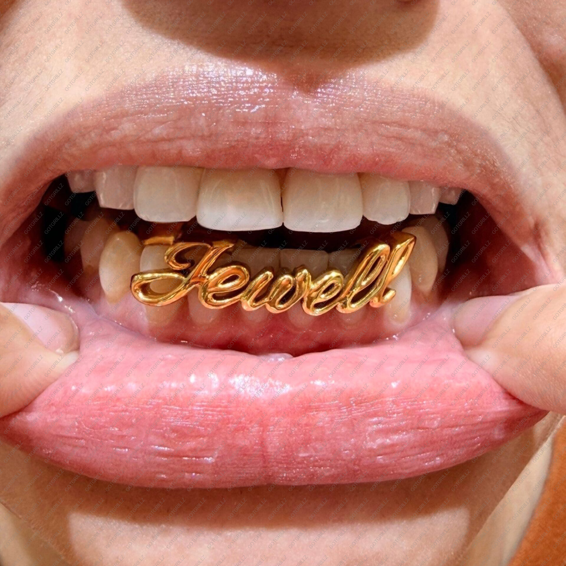 custom Gold cursive letter grillz